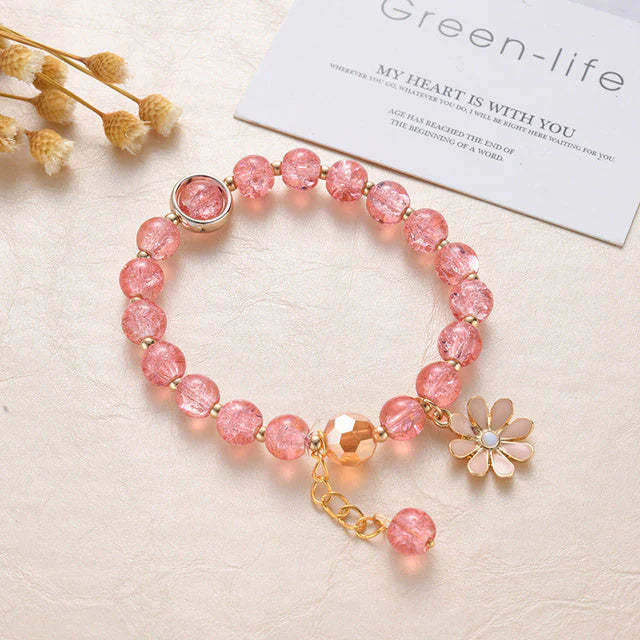 Armband mit rosa Steinen und Gänseblümchen